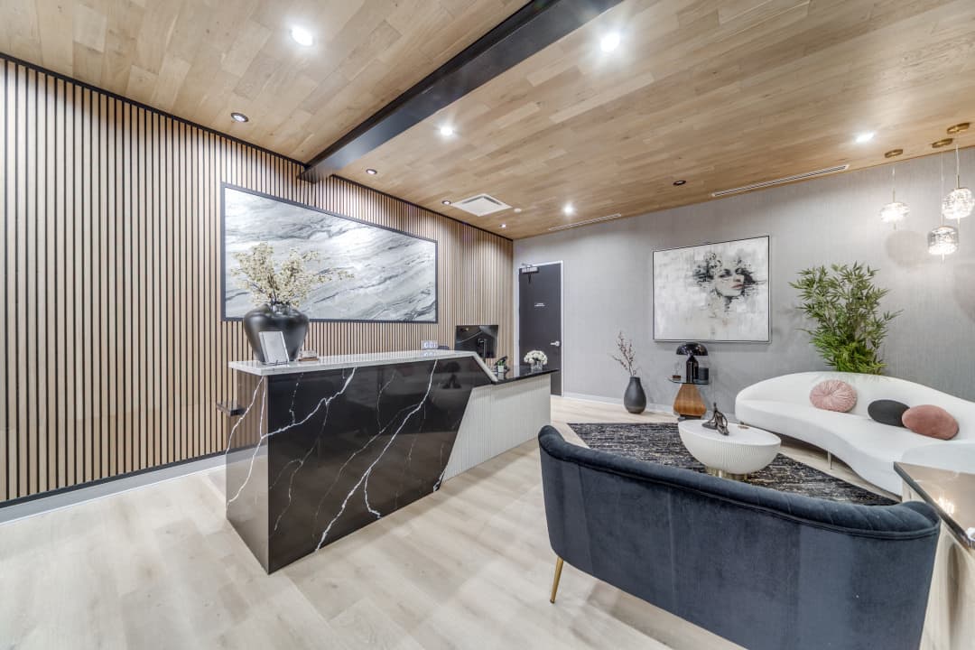 Modern reception area with wood accent wall and curved seating