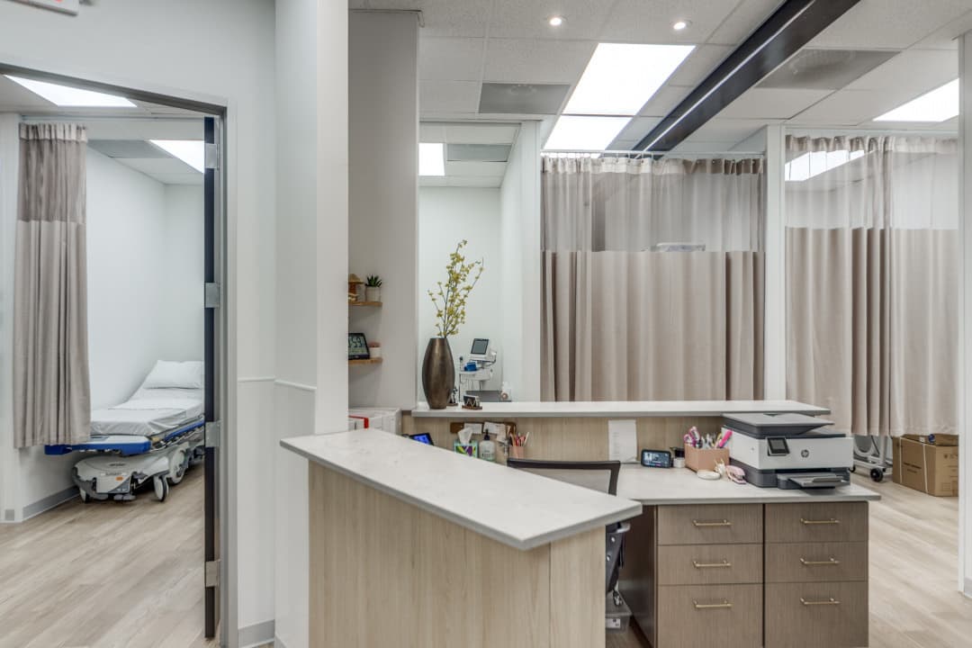 Nurses station with curtained patient care areas