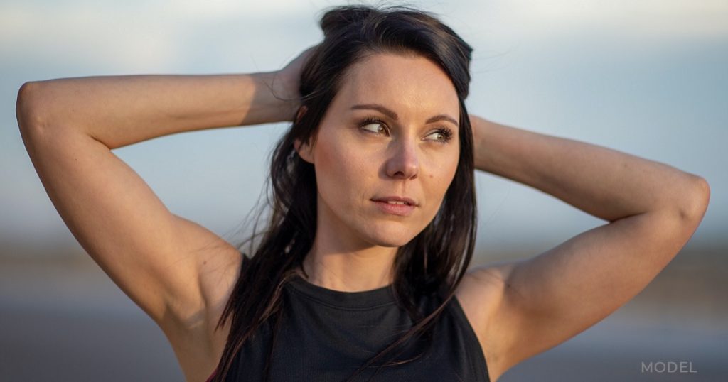 Woman showing off toned arms