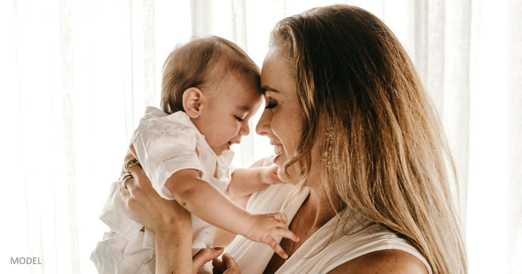 Mom with baby considering a mommy makeover