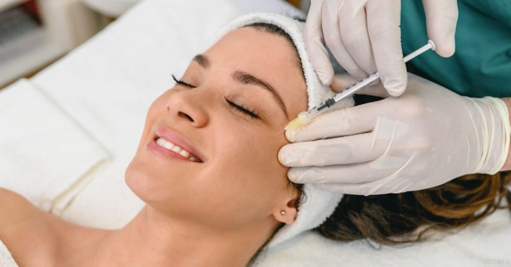 Woman receiving a BOTOX treatment (models)